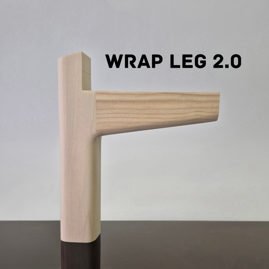 Wooden leg with 'Wrap Leg 2.0' text on a gray background